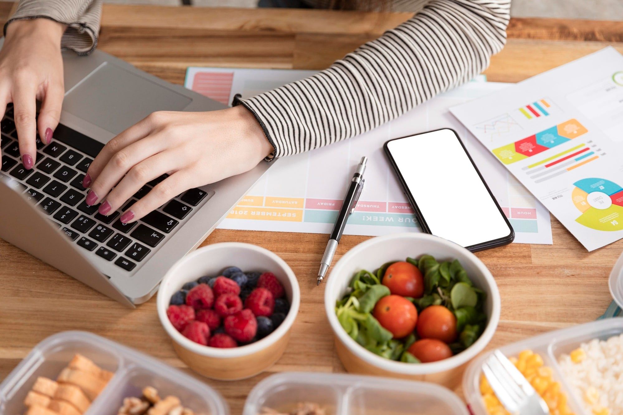 A lady working on the laptop on a table