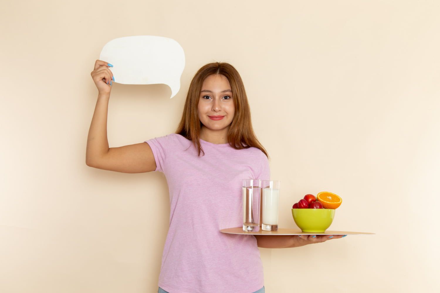 girl holding a tray filled with fruits and water in one hand and in one hand the sign of a message bubble