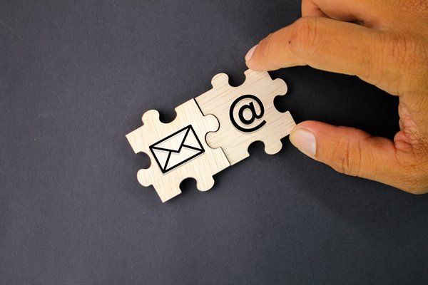 Puzzle pieces of Email and "@" 