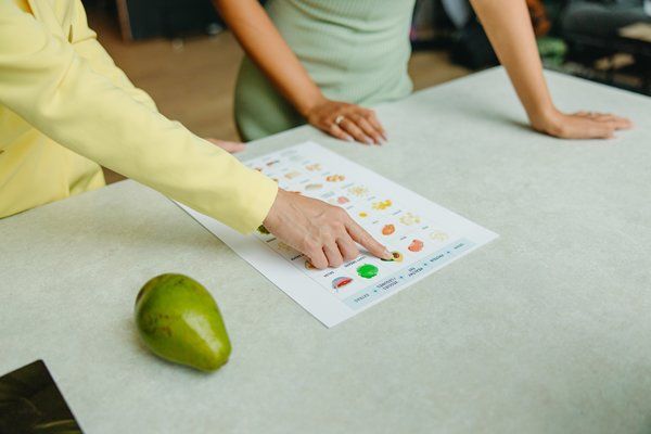 A nutritionist explaining diet plan to a client 